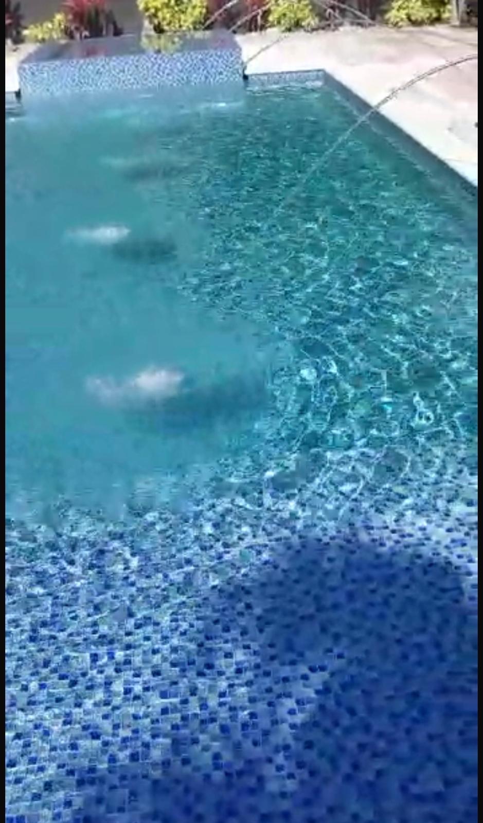 Completed custom pool with vertical water jet features